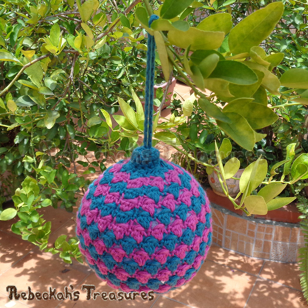 Striped Bobble Bauble on a lemon tree! | Amigurumi Crochet Pattern by @beckastreasures | Written pattern + photo tutorials too | Available to purchase in my #Ravelry & Website shops or via #GreybriarsTravels magazine - Get your copy today! | #crochet #pattern #amigurumi #christmas #bauble #ornament 