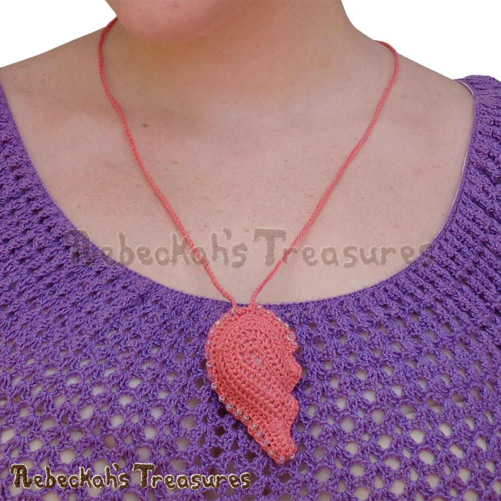 Left Heart Half CLOSE-UP on Me! | Dusty Rose Jumbo Broken Hearts Necklace Set Story | A Crochet Pattern by @beckastreasures for @getstuffed | Is it an amigurumi or an appliqué? Will it be a necklace, a fob or a pillow? Are the hearts separated to share with your besties or kept whole to show broken hearts can be mended? YOU get to decide!!! | #crochet #pattern #brokenheart #valentine #heart #amigurumi #appliqué #necklace #fob #pillow