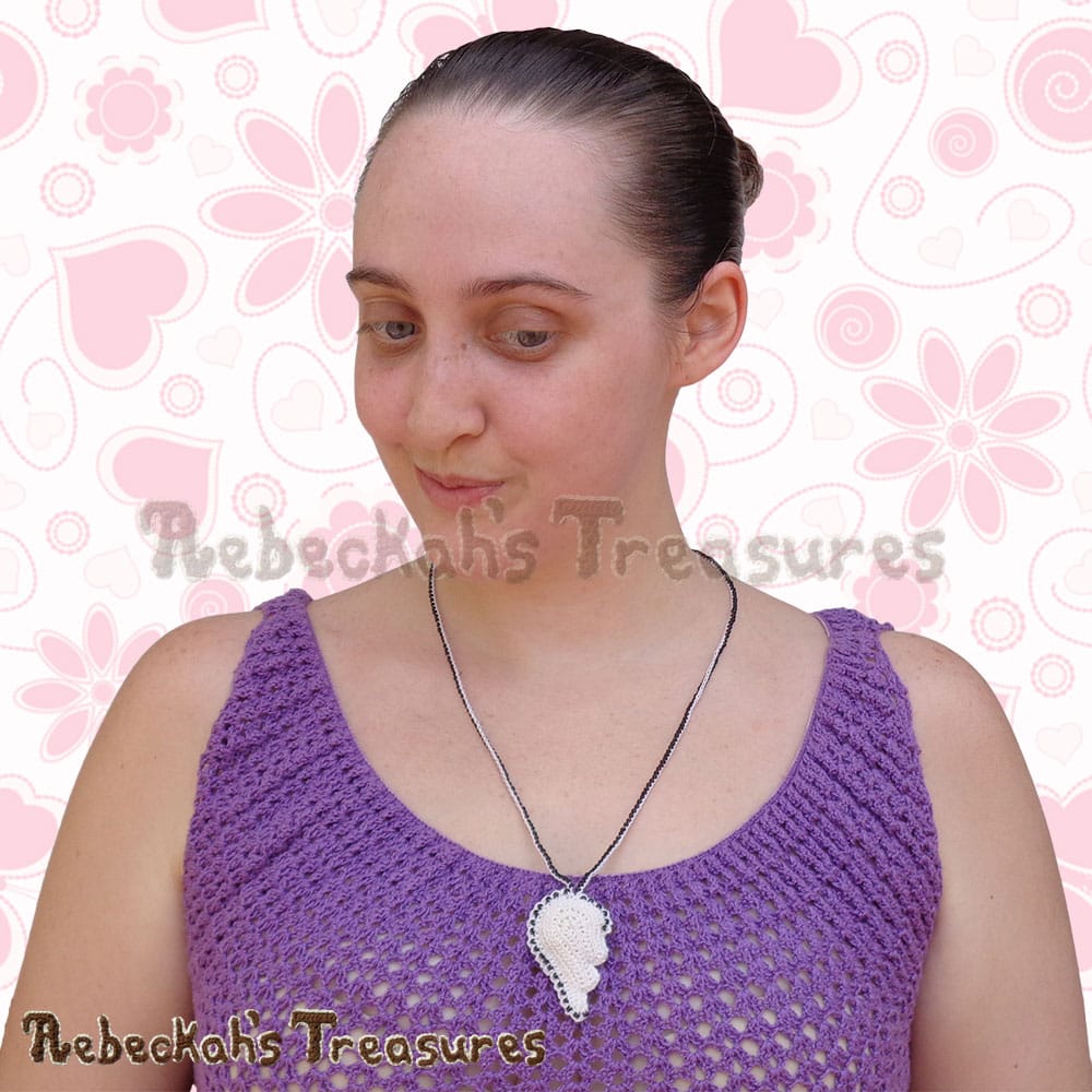 Me wearing the LEFT half of the Friendship Broken Hearts Necklace! | Crochet Pattern by @beckastreasures for @getstuffed! | Will it be an amigurumi or an appliqué? Will it be a necklace, a fob or a pillow? Will the hearts be separated to share with your besties or kept whole to show broken hearts can be mended? YOU get to decide!!! | Available exclusively in #GetStuffedMagazine - the January 2017 issue - Get your copy today! | #crochet #pattern #brokenheart #valentine #heart #amigurumi #appliqué #necklace #fob #pillow