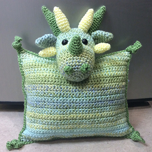 Dragon Pillow - Crochet Pattern by @lisakingsley4 | Featured at Lisa Kingsley Designs - Sponsor Spotlight Round Up via @beckastreasures | #fallintochristmas2016 #crochetcontest #spotlight #crochet #roundup