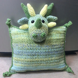 Dragon Pillow | Friday Feature #13 via @beckastreasures with @LisaKingsley4 #crochet | See the latest designer features here: https://goo.gl/UIvoYx OR SIGN UP to get featured at Rebeckah's Treasures here: https://goo.gl/xjDP52 #crochet